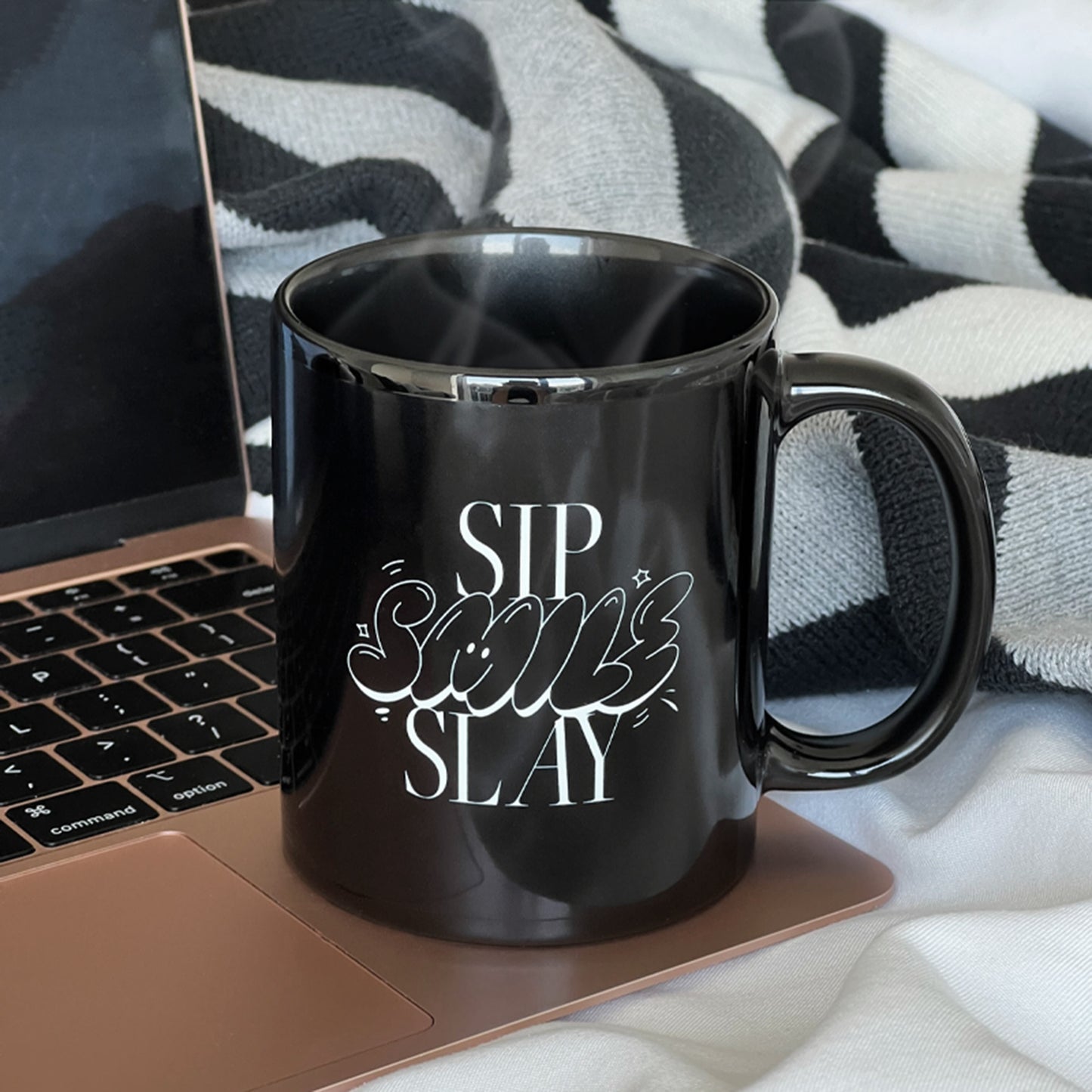 Black mug with the words "sip, smile, slay" on it